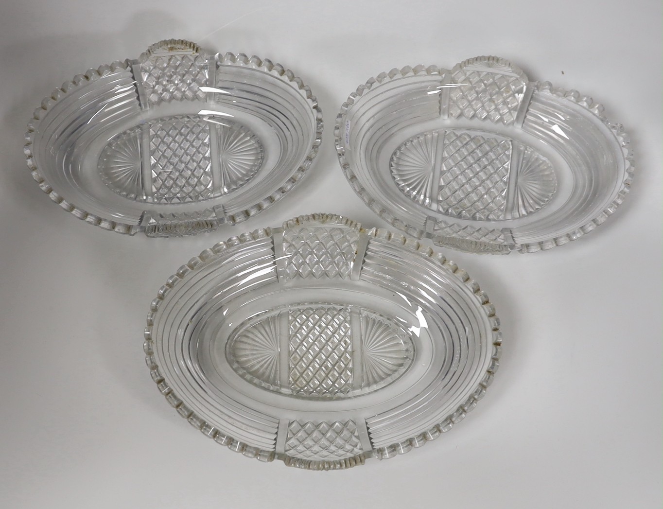 A set of three Regency heavy cut glass dishes, 25 and 27cm